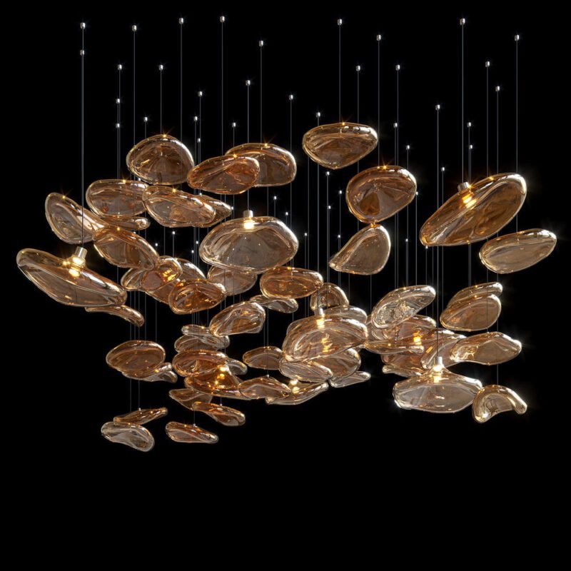 A stunning large chandelier showcasing innovative custom lighting design for upscale hotels. This big chandelier features numerous amber-colored glass elements shaped like organic petals or pods, suspended at varying heights on thin wires. Each petal-like piece is illuminated from within, creating a warm, golden glow against a dark background. The hotel chandelier's unique composition resembles a floating cloud of luminous shapes, arranged in an asymmetrical, organic pattern. This exquisite custom lighting installation transforms the space into an enchanting, nature-inspired display, perfect for creating a sophisticated and luxurious atmosphere in high-end hospitality environments.