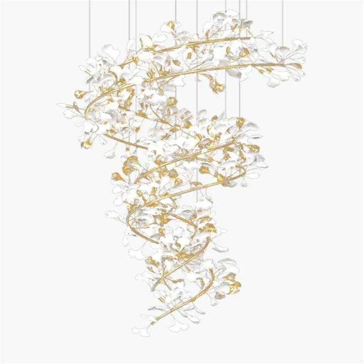 An elegant spiral chandelier featuring delicate white glass petals and gold-toned branches against a white background. The chandelier has an organic, tree-like structure that twists downward in a graceful helix. Numerous white glass elements, resembling stylized flowers or leaves, are attached to the golden metallic framework, creating a cascading effect. The fixture is suspended by thin wires, giving it a floating appearance. The interplay between the translucent white glass and the shimmering gold accents creates a soft, ethereal glow. The chandelier's intricate design combines natural, botanical-inspired forms with luxurious materials, resulting in a stunning piece that bridges the gap between functional lighting and sculptural art. The white-on-white presentation emphasizes the chandelier's delicate structure and intricate details.