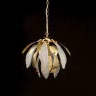 An elegant pendant chandelier illuminated against a dark background, showcasing a harmonious blend of gold and crystal elements. The fixture resembles a blooming flower or artichoke, with alternating gold and crystal petals radiating outward from a central core. The gold petals have a smooth, ribbed surface with a warm metallic sheen, curving gracefully outward. The crystal petals are clear and intricately textured with a pattern reminiscent of delicate leaf veins, adding a translucent and ethereal quality to the design. These crystal elements catch and refract the light emanating from within the chandelier, creating a soft, glowing effect. The warm light from the fixture's interior highlights the intricate details of both the gold and crystal components. The chandelier is suspended by a delicate gold chain, adding to its refined appearance. This piece masterfully combines organic, nature-inspired forms with luxurious materials, resulting in a striking blend of contemporary design and classic elegance. The illuminated chandelier appears to float in the darkness, emphasizing its role as both a functional light source and a captivating decorative element.