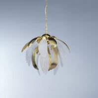 A stunning pendant chandelier featuring a harmonious blend of gold and crystal elements, suspended against a light gray background. The fixture resembles a blooming flower or artichoke, with alternating gold and crystal petals radiating outward from a central core. The gold petals have a smooth, ribbed surface with a warm metallic sheen, curving gracefully outward. The crystal petals are clear and intricately textured with a pattern reminiscent of delicate leaf veins, adding a translucent and ethereal quality to the design. These crystal elements catch and refract light, creating a subtle sparkling effect. The chandelier is suspended by a delicate gold chain, adding to its refined appearance. This piece masterfully combines organic, nature-inspired forms with luxurious materials, resulting in a striking blend of contemporary design and classic elegance. The chandelier appears both delicate and substantial, promising to be a captivating focal point in any interior space, while its compact size suggests it would be suitable for a variety of room sizes and styles.